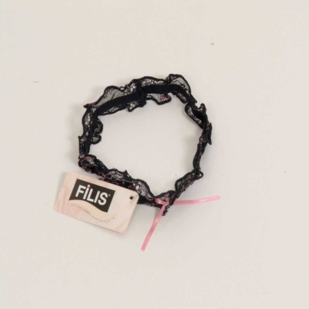 Filis Garter Black with pink threads and pink ribbon with bow in the middle.